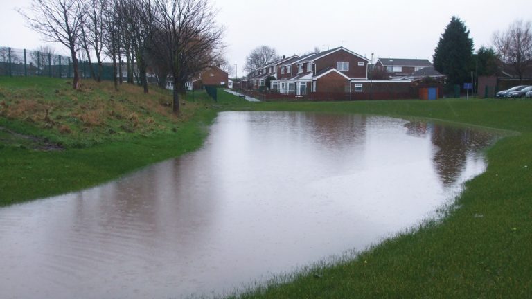 Detention basin during heavy rainfall of winter 2015 - Courtesy of MWH