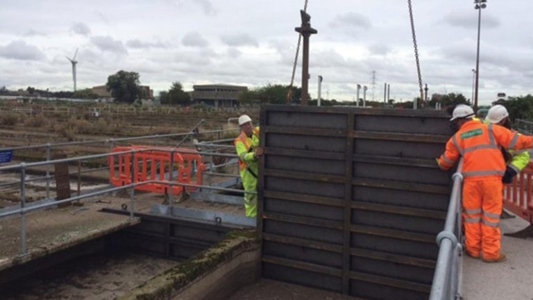 Figure 2 - Installation of timber ‘dam board’ into inlet channel to isolate incoming flows to aeration lane - Courtesy of MWH Treatment