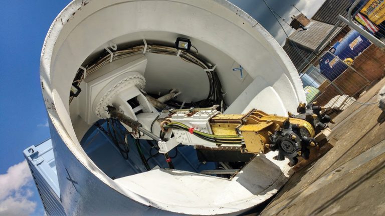 Rock wheel attachment during TBM assembly - Courtesy of NMCNomenca