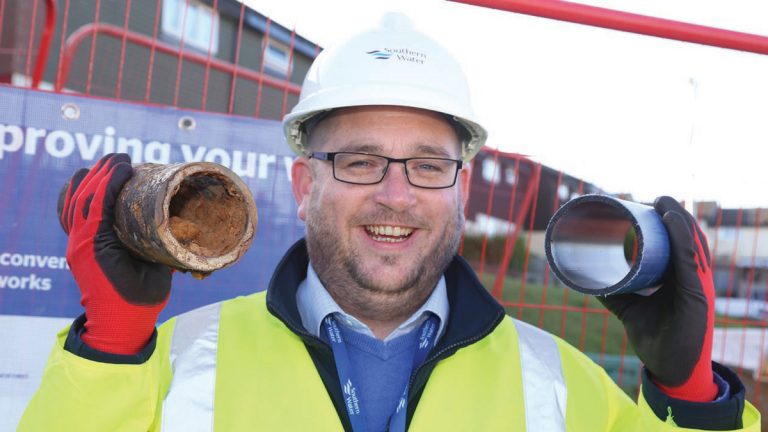 Project manager Mark Newman with an old pipe and new - Courtesy of Southern Water