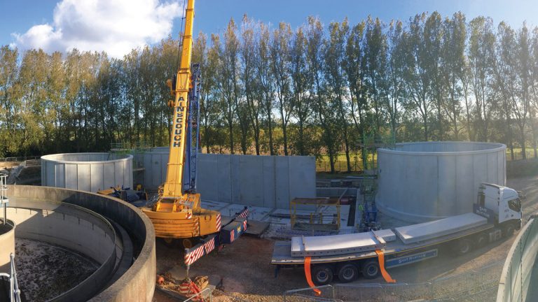 Positioning of wall units lifted directly from delivery wagons and placed into the tank - Courtesy of C2V+