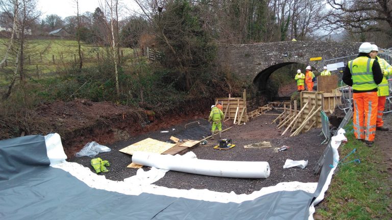 PVC liner installation on prepared canal bed - Courtesy of Arcadis