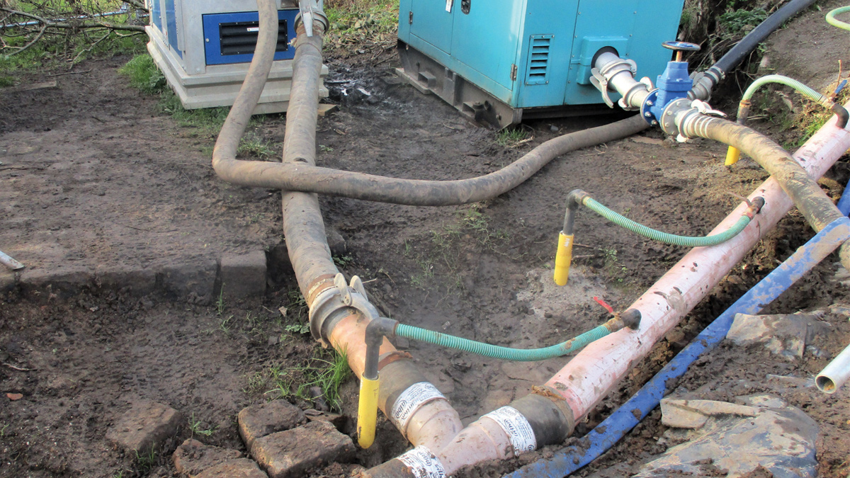 Groundwater control system showing suction wells and header pipe - Courtesy of OGI Groundwater Specialists