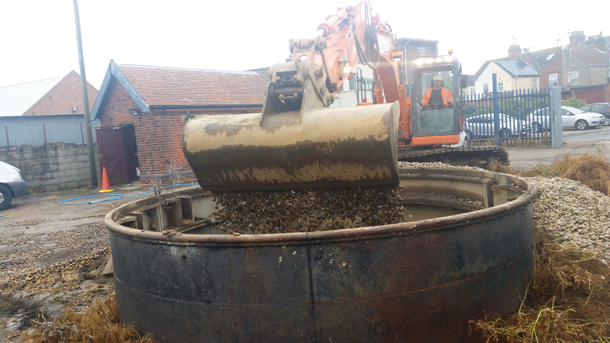 Filling in tunnel shafts with hard core and gravel - Courtesy of Northumbrian Water Limited