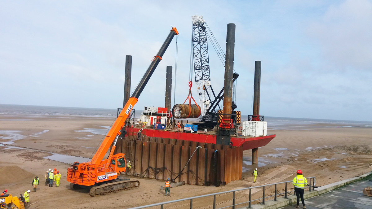 Removal of TBM from temporary marine cofferdam onto the jack-up barge - Courtesy of United Utilities