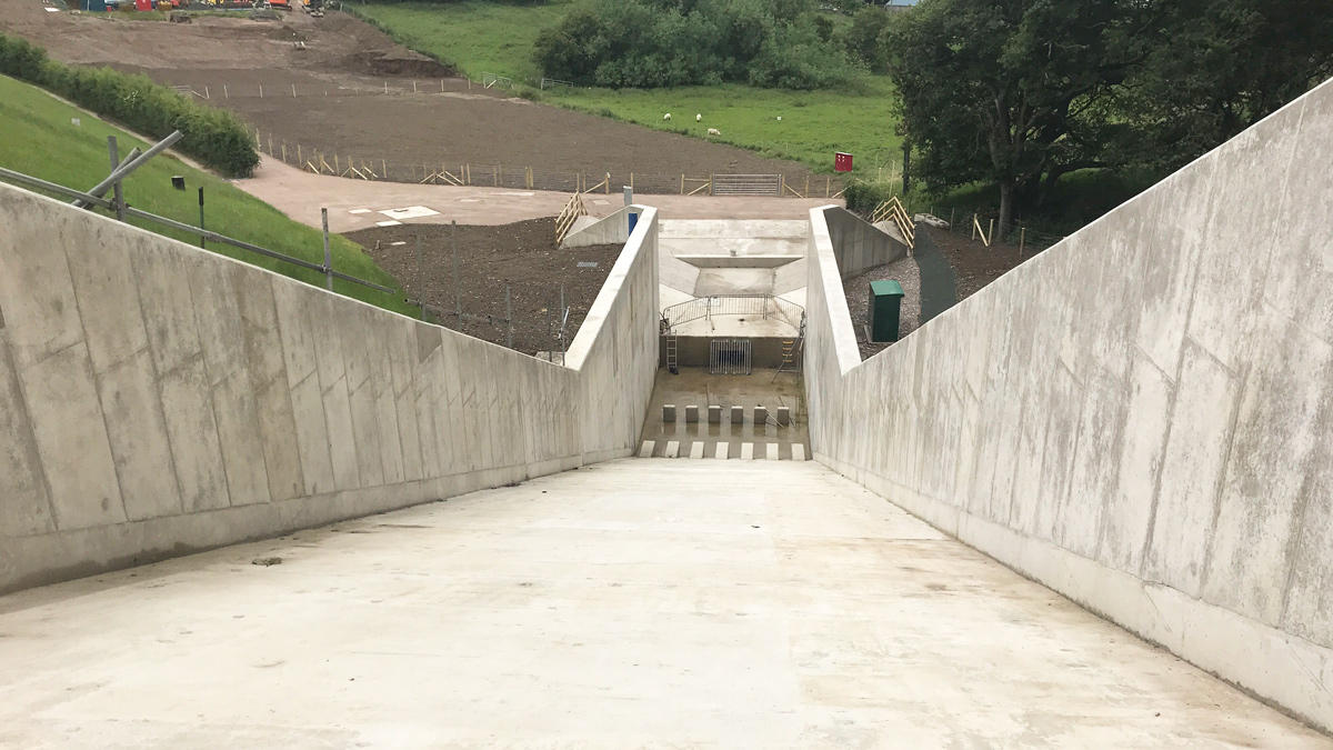 Looking down the spillway chute and into the stilling basin - Courtesy of Skanska