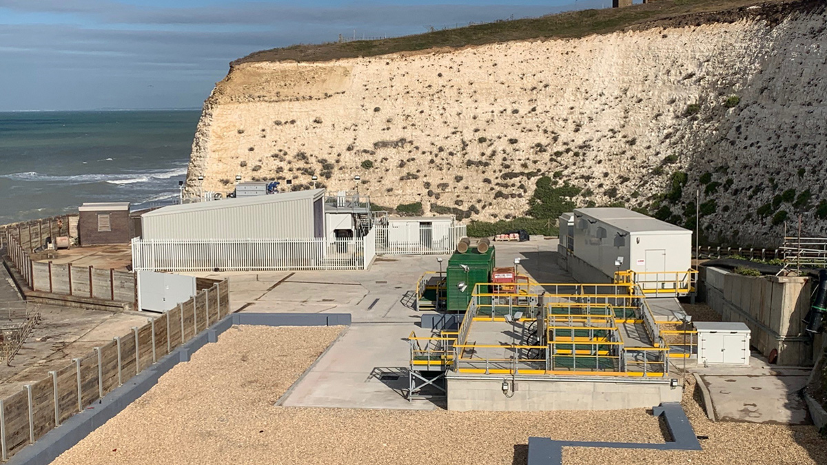 The new inlet works and screenings plant, MCC and standby generator. The photo also shows the basement walls of the old building. The above ground concrete walls and roof were crushed on site and used as fill material, reducing the scheme's carbon footprint - Courtesy of CMDP