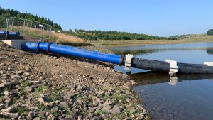 Installation of the twin pipe siphon system at Dean Clough Reservoir - Courtesy of Costain