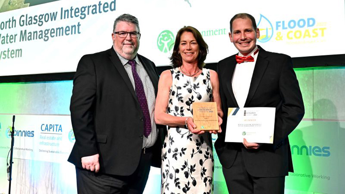 Pictured is AECOM's Principal Engineer Debbie Hay-Smith along with Jamie Cobb from Fairfield Control Systems Ltd, collecting the award from Ian Hodge of the Environment Agency.