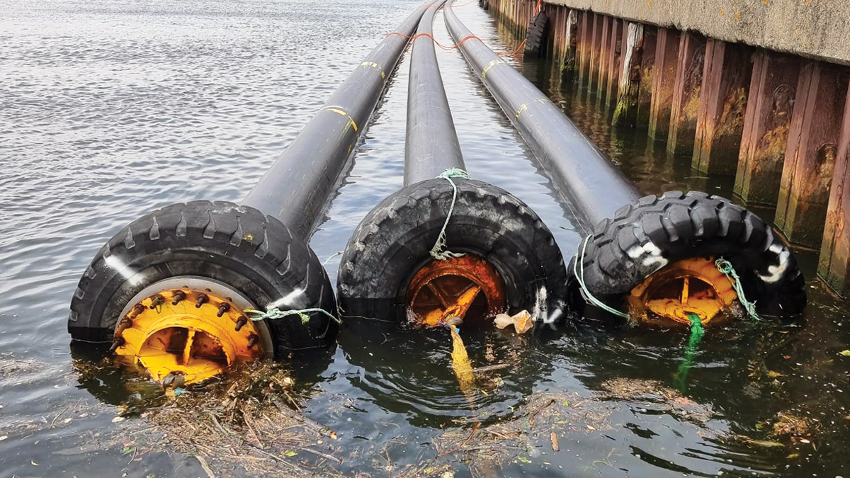 Outfall pipe floated along the quay wall in Arklow prior to preparation and assembly works - Courtesy of Pipelife Norge AS