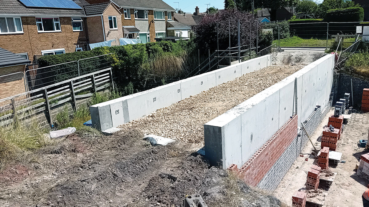 Decommissioning the original primary spillway with double concrete walled structure with fascia to match original spillway - Courtesy of Kier