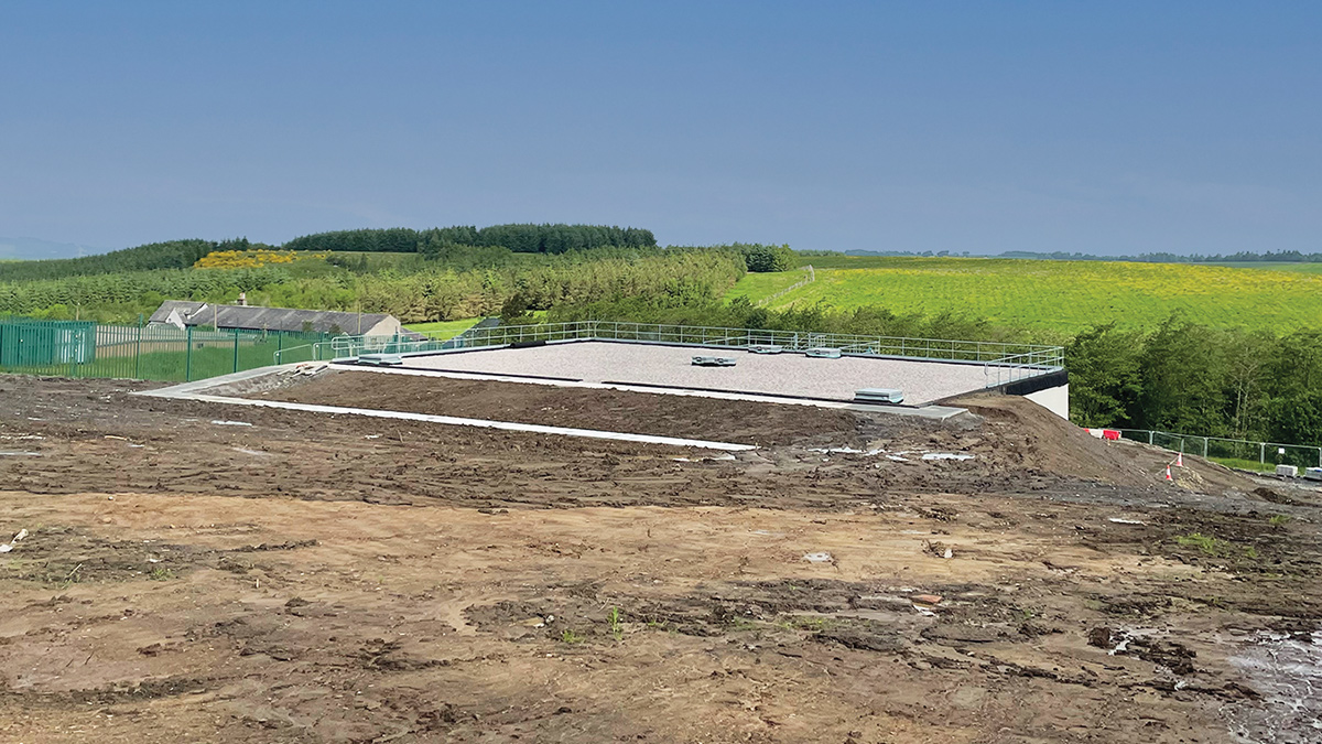 View of tank with backfill almost completed. Pedestrian crane on the left - Courtesy of ESD JV