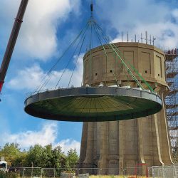 The new water tower roof being lifted into place - Courtesy of @one Alliance