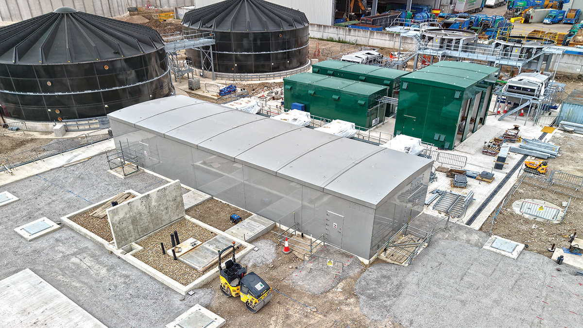 Figure 7: Sludge processing area: MCC kiosk (grey in foreground), sludge blending tanks (top left), poly dosing kiosks (top right) - Courtesy of BAM