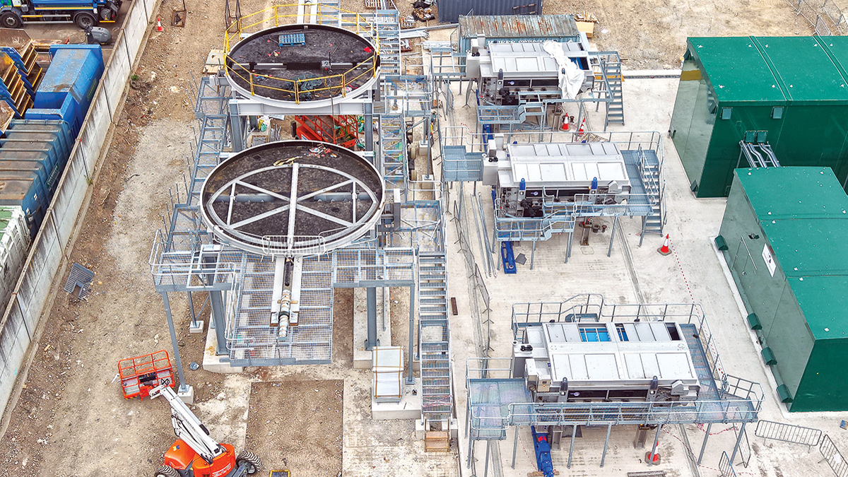 Figure 8: Sludge processing area: (left) the bases for elevated cake silos, (middle), sludge belt presses, and (right) the poly prep & dosing kiosks - Courtesy of BAM