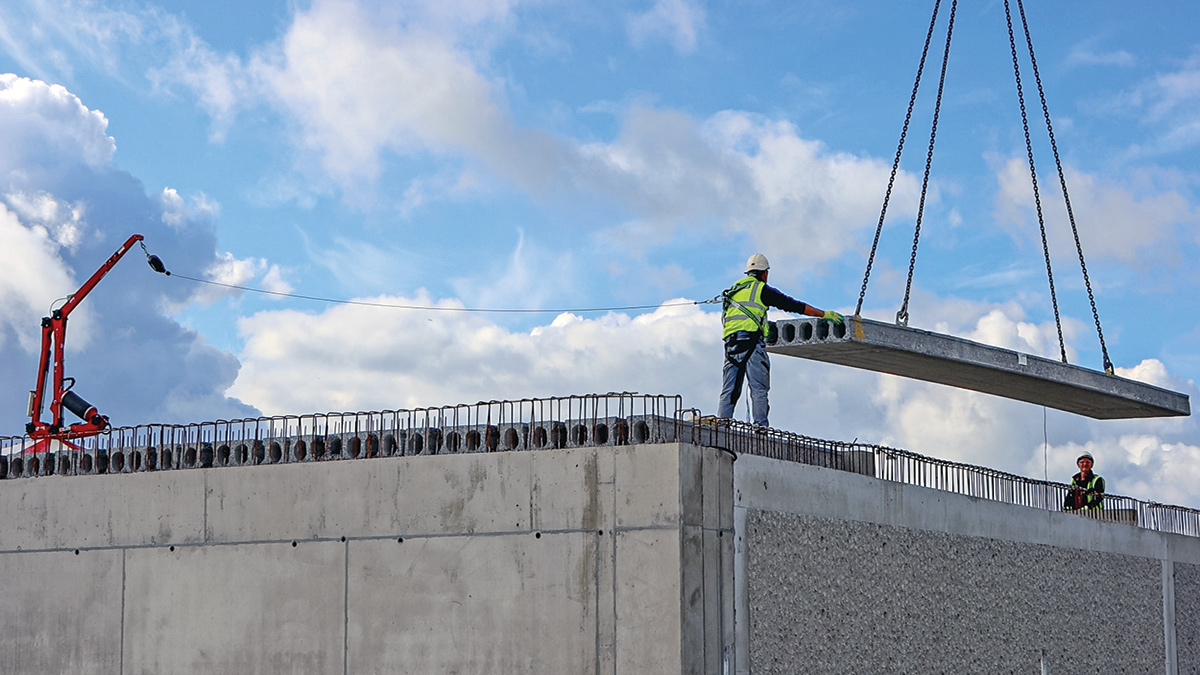 Lowering a precast floating roof section - Courtesy of Coffey