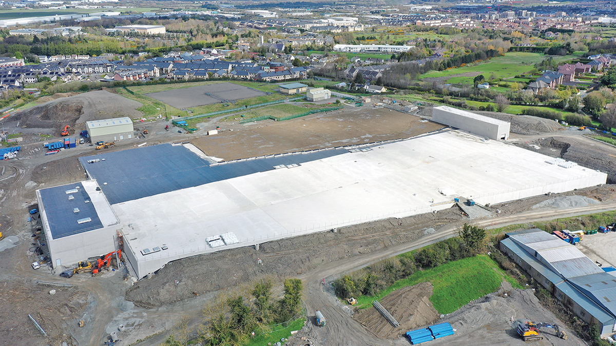 Laying geotextile on roof - Courtesy of Coffey