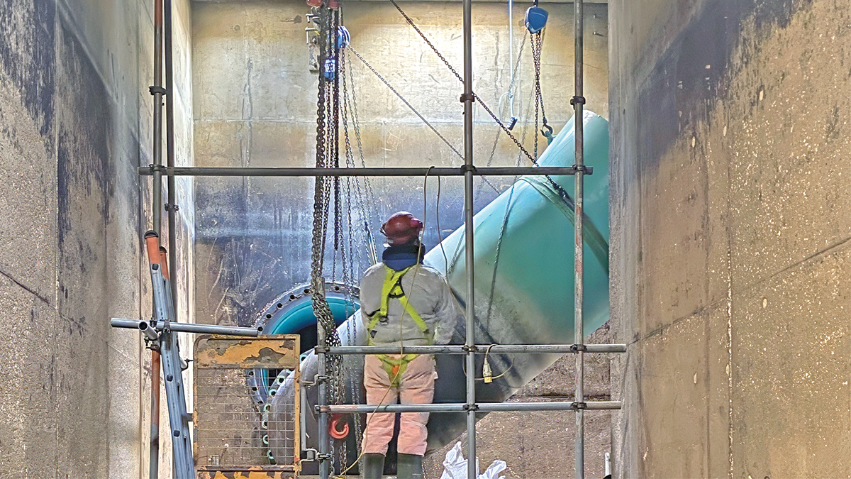 The existing overflow being lowered to create the new contact tank inlet - Courtesy of MWH Treatment