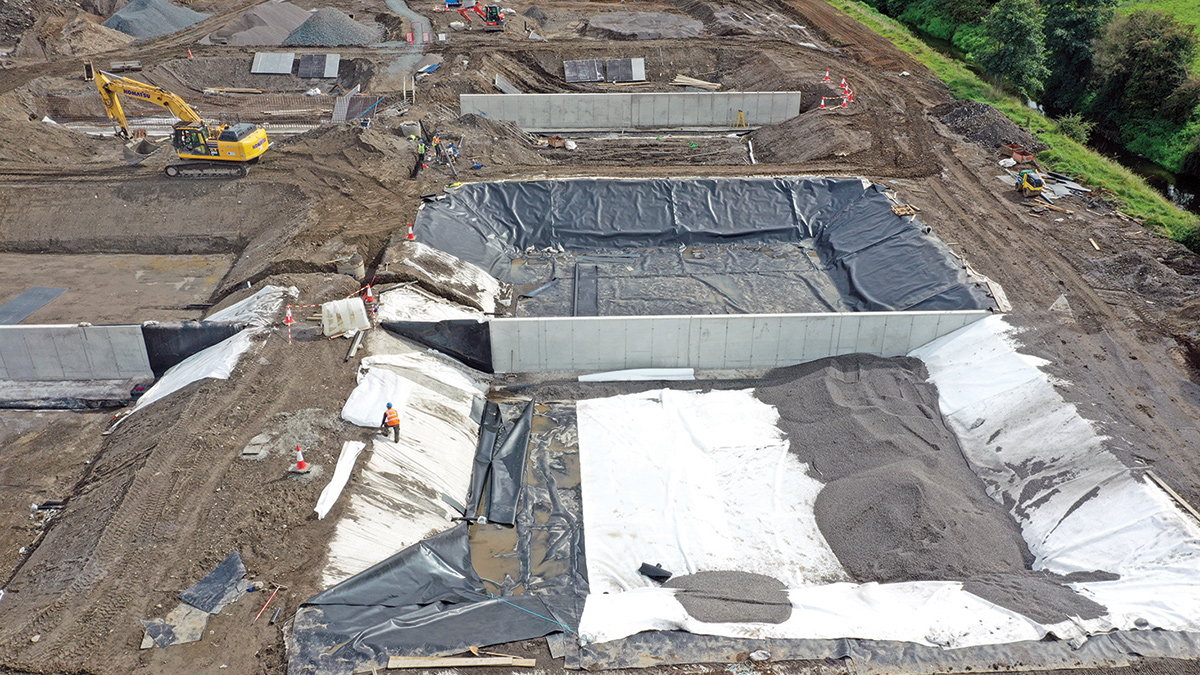 Construction of SDRB cells: Welded HDPE liner covered with geotextile and base layer of filter media - Courtesy of Coffey