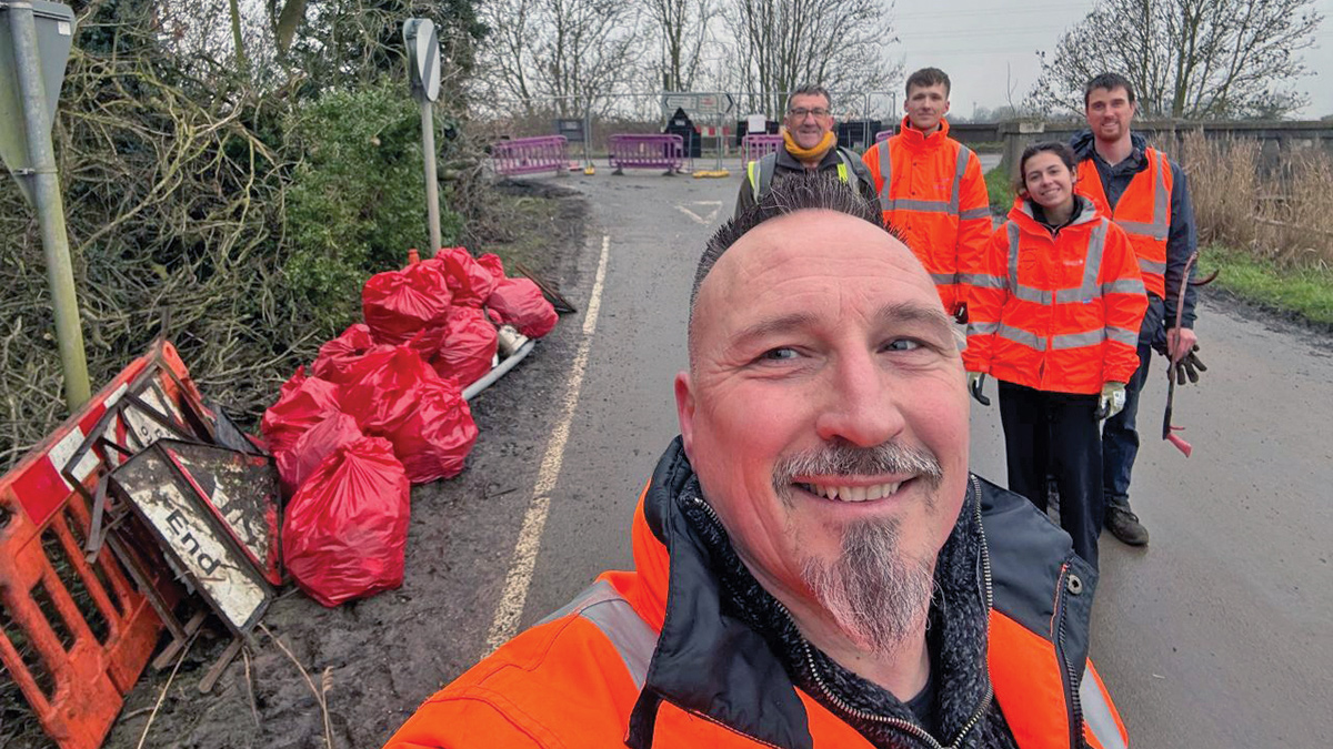 Teams members working with community groups to pick up litter - Courtesy of @one Alliance