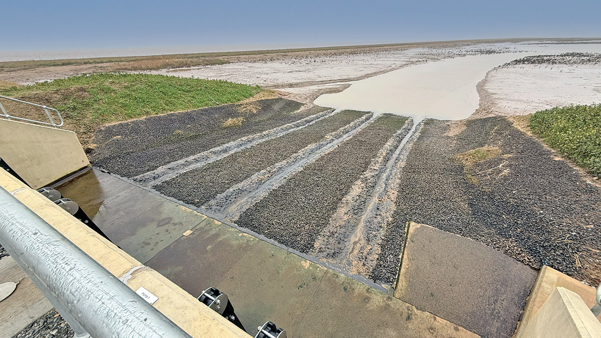 Open stone asphalt (OSA) implemented on discharge channel replacing conventional hard-engineered materials - Courtesy of JBA Bentley