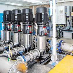 Inside the new booster station: 4-pump Grundfos skid tied onto riser pipework with individual pump controls and MCC - Courtesy of Esh Stantec